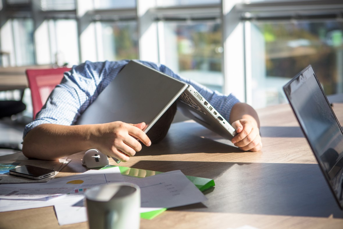 Man Given Up Under Laptop